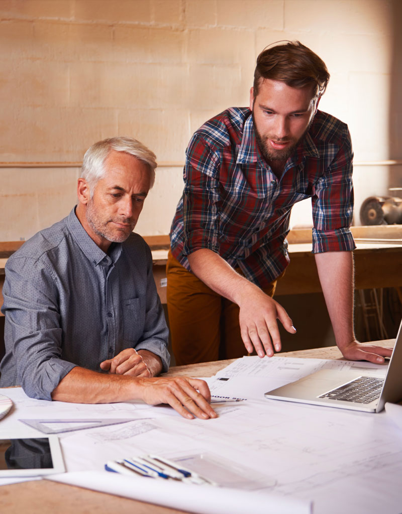 Homeowner reviewing renovation plans with an A&A Pro estimator